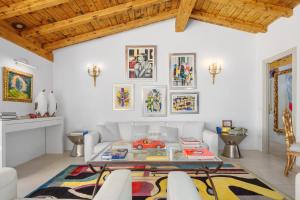 a living room with a white couch and a table at Villa Maryna in Olbia