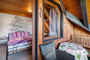 a room with a bed and a window at Ferienwohnung Karin in Schonach