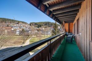a balcony of a building with a view of a city at Ferienwohnung Karin in Schonach
