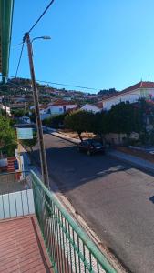 a street with a car parked on the road at Ká T'Espero in Penha Garcia