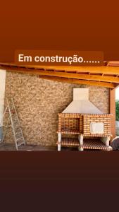 a model of a building with a stove and a ladder at Ká T'Espero in Penha Garcia