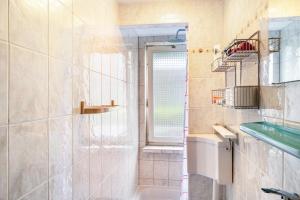 a bathroom with a shower and a sink at Haus Seeblick in Malchow +15 photos