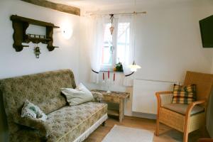 a living room with a couch and a table at Gästehaus Minkel in Gudensberg
