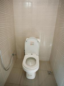 a small bathroom with a toilet in a stall at Kili Tanzania in Moshi