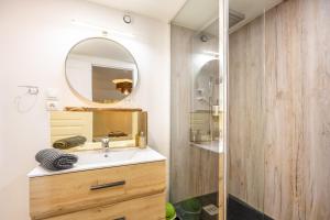a bathroom with a sink and a mirror at Chambres d'hôtes Le Boiziller in Saint-Michel-Mont-Mercure +59 photos