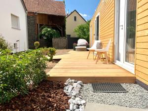 a wooden deck on the side of a house at Tiny Haus Liederbach in Alsfeld