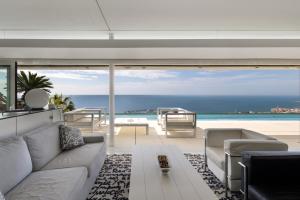 a living room with a view of the ocean at Casa Nirvana - Penthouse in Sitges