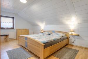 a bedroom with a bed in a room with white walls at Mill Nordkirchen in Nordkirchen