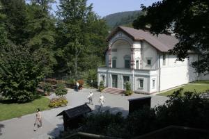 a group of people walking in front of a house at Haus Mühlgrund in Bad Wildbad