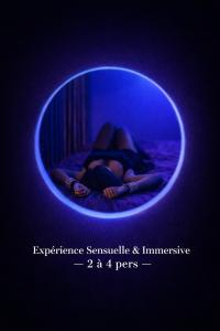 a person is sleeping in a blue room at L'Apothéose in Saint-Jean-les-Deux-Jumeaux
