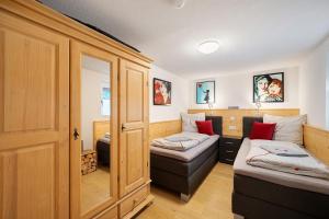 a room with two beds and a couch at Ferienwohnung Morgensonne in Wolfach