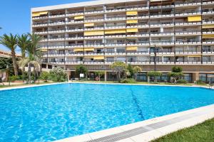 a large swimming pool in front of a building at Casa Pedro Santa Clara in Torremolinos