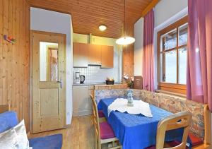 a kitchen and a table in a room at Appartments Radauerhof in Castelrotto