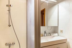 a bathroom with a sink and a shower at Haus Excelsior Top 2 in Seefeld in Tirol +17 photos