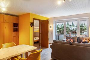 a living room with a couch and a table at Haus Excelsior Top 2 in Seefeld in Tirol