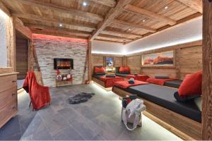a room with a bed and a fireplace at Appartments Radauerhof in Castelrotto
