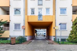 an empty street in front of a building at Apartment Magdeburg in Magdeburg