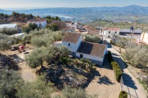 an aerial view of a house with solar panels on its roof at Cortijo Salva in Periana