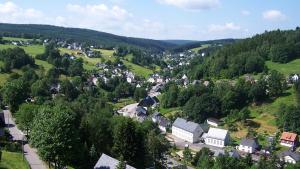 an aerial view of a small village in the hills at Huthaus zum Molchner Stollen in Pobershau