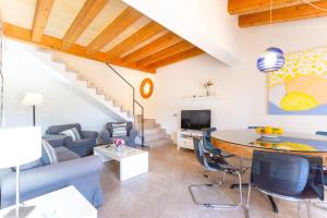 a living room with a couch and a table at Finca Son Fornes in Búger