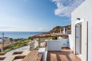 a view of the ocean from the balcony of a house at Mont' Rock villas 1 in Posidhonía