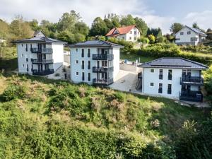 a group of white houses on a hill at Egge Resort 7d mit Whirpool u Sauna in Altenbeken