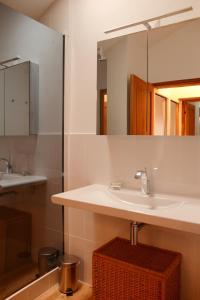 a bathroom with a sink and a mirror at Chant du Buc, le Loft in Marssac-sur-Tarn