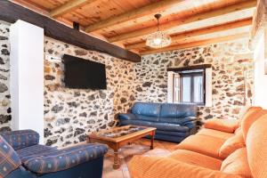 a living room with a couch and a table at Casa Trasmiera in Solórzano