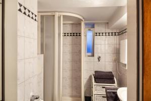 a bathroom with a shower and a sink at Höllental 51 in Garmisch-Partenkirchen +18 photos