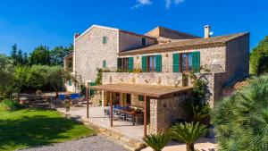 an external view of a house with a patio at Finca Rafal in Son Servera