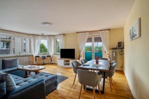 a living room with a couch and a table at Apartment Albert-Schulte Park in Worms