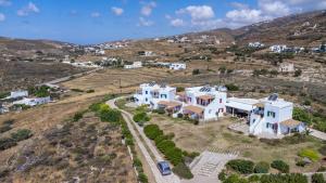 an aerial view of a villa with white houses at Anemologio 102 Tinos in Agios Ioannis +11 photos