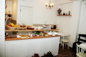 a kitchen with a counter with food on it at Hotel Delisi in Tbilisi City