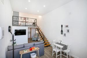 a living room with a couch and a table at Loft El Ramonal in Candelaria