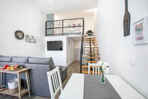 a living room with a couch and a table at Loft El Ramonal in Candelaria