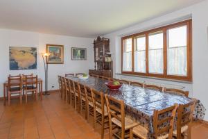 a dining room with a table and chairs at Tenuta Vallegaia in Rosignano Marittimo