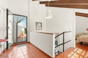 a room with a glass door leading to a bedroom at Casa Limón in Vélez-Málaga