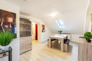 a kitchen and dining room with a table at Tapas Restaurante 2 in Viersen