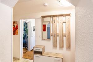 a bathroom with a mirror and a sink at Tapas Restaurante 2 in Viersen