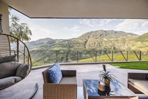 a living room with a view of a mountain at Apartment 16 cityview in Cornedo all'Isarco