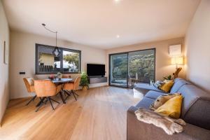 a living room with a couch and a table at Apartment 16 cityview in Cornedo all'Isarco