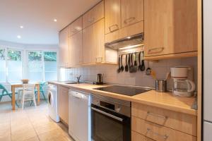 a kitchen with a sink and a stove top oven at Fuengirola Hills with Seaview in Fuengirola