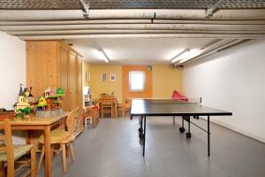 a room with a ping pong table in it at Wanderglück in Missen-Wilhams