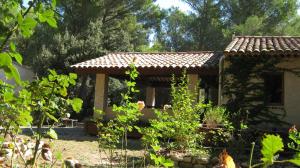 a house with a tiled roof in a garden at Gites Croignes-Ponant in Lambesc