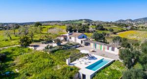 an aerial view of a house with a swimming pool at Finca Sa Real in Cala Millor