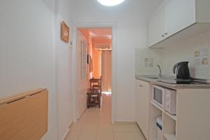 a kitchen with a sink and a counter top at Andromaches large apartment in Virós