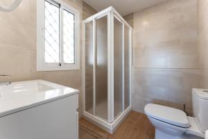 a bathroom with a toilet and a sink and a shower at Apartment Mijas Sun and Beach in Sitio de Calahonda +18 photos