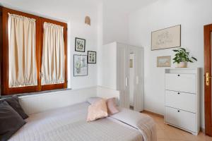 a bedroom with a bed and a window at Casatullio - Sant'Angelo d'Ischia in Sant'Angelo D'Ischia