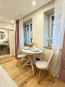 a dining room with a table and two chairs at Fewo Sand 10 - Altstadtstudio in Bamberg
