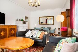 a living room with a couch and a table at Siravit Am See in Friedrichshafen
